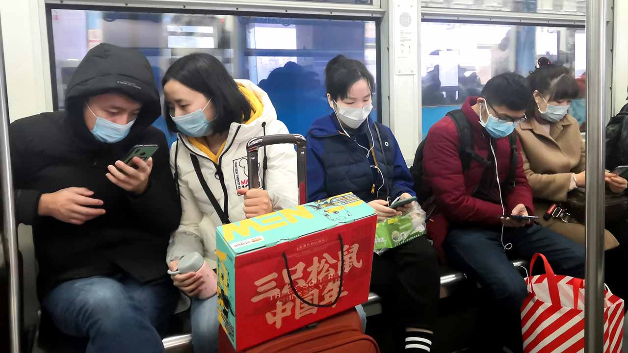 Commuters take precautions against the cornonavirus in the central Chinese city of Chinese of Chongqing on January 23, 2020. Source: Shutterstock